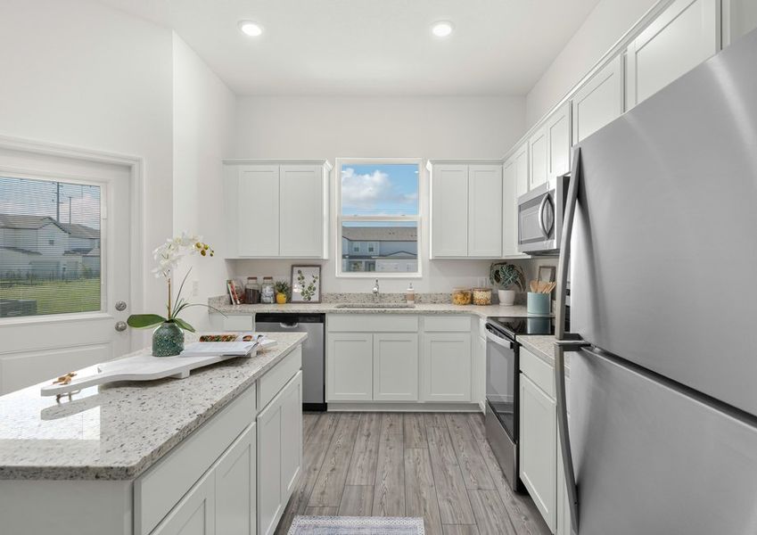 The kitchen comes with a full suite of stainless steel appliances!