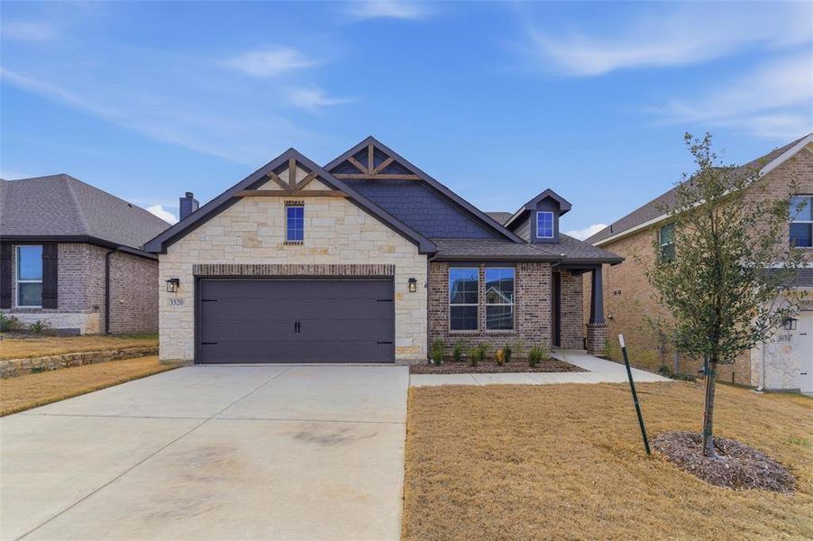 Front exterior of a new home in Liberty Pointe, Gainesville, TX, highlighting curb appeal (Image 19).