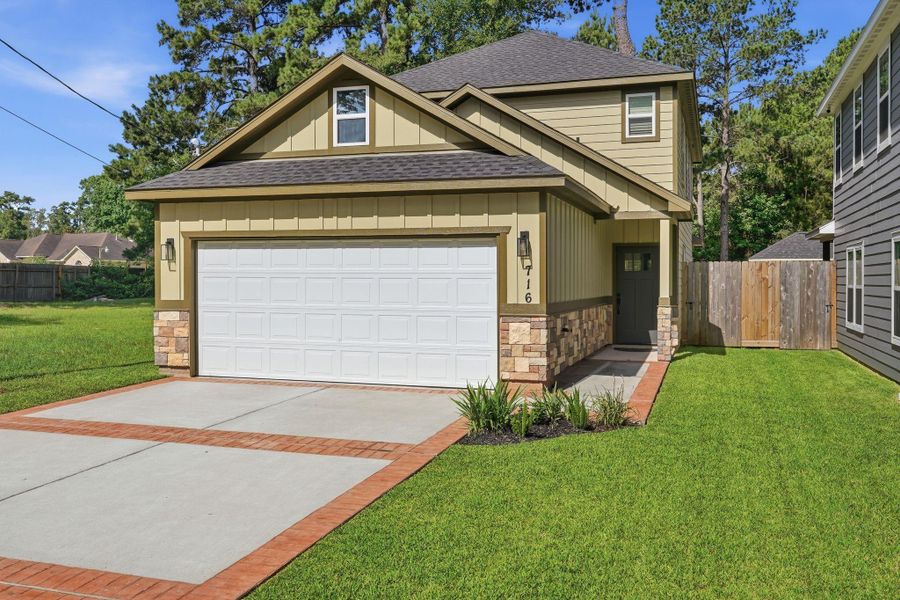 Front exterior of a new home in , Conroe, TX, highlighting curb appeal (Image 2). Front exterior of a new home in , Conroe, TX, highlighting curb appeal (Image 2).