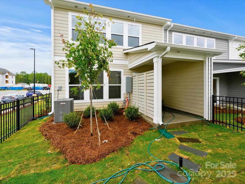 Front exterior of a new home in North Creek Village - Townhomes, Huntersville, NC, highlighting curb appeal (Image 2). Front exterior of a new home in North Creek Village - Townhomes, Huntersville, NC, highlighting curb appeal (Image 2).