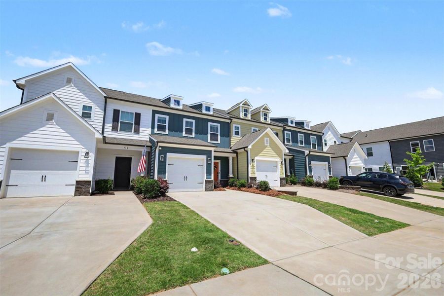 Front exterior of a new home in , Clover, SC, highlighting curb appeal (Image 23).
