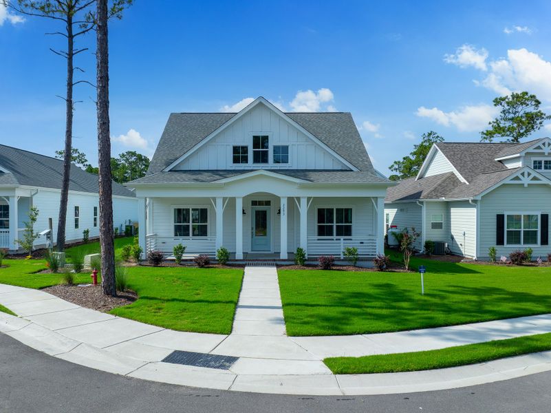 Front exterior of a new home in Osprey Landing, Southport, NC, highlighting curb appeal (Image 23).