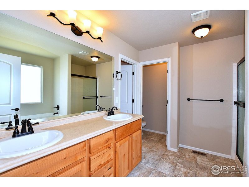 Furnished interior view inside a new home in Union Colony West, Greeley (Image 13).