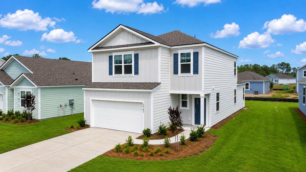 Front exterior of a new home in Hillcrest, Ravenel, SC, highlighting curb appeal (Image 2). Front exterior of a new home in Hillcrest, Ravenel, SC, highlighting curb appeal (Image 2).