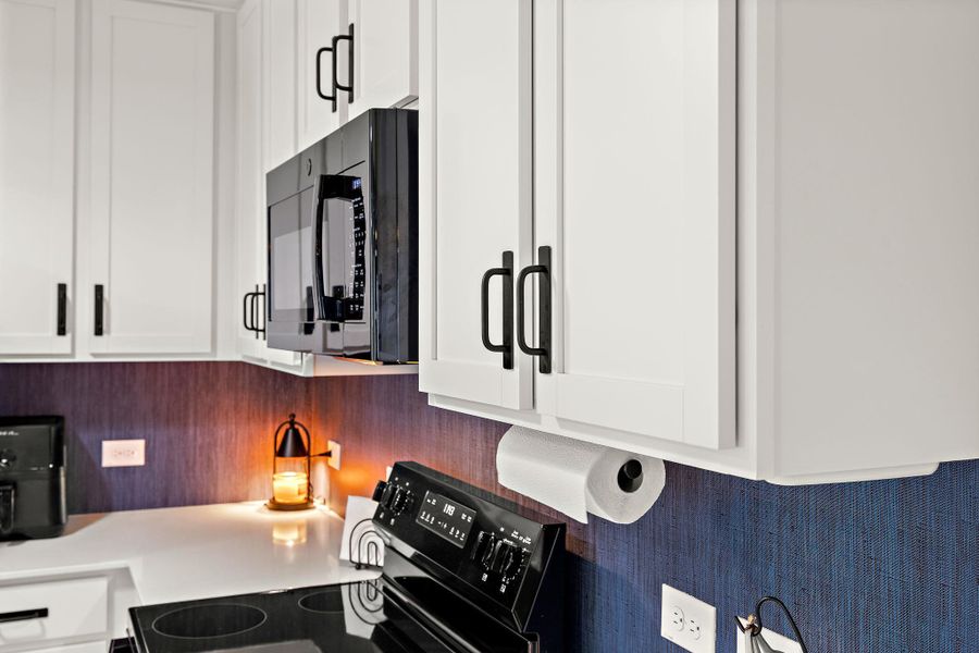 Upgraded cabinet hardware adds a modern finishing touch. Upgraded cabinet hardware adds a modern finishing touch.