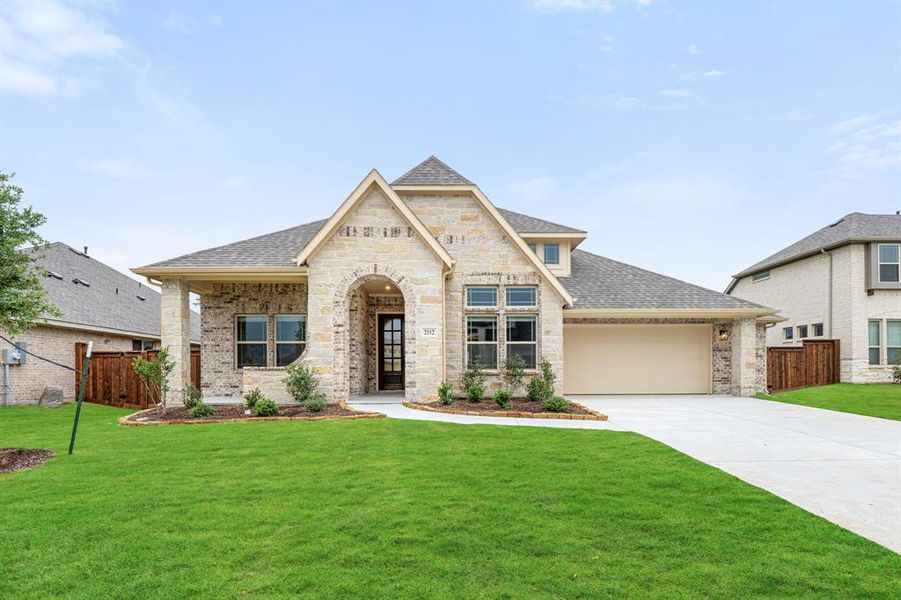 Front exterior of a new home in Somerset, Venus, TX, highlighting curb appeal (Image 2).