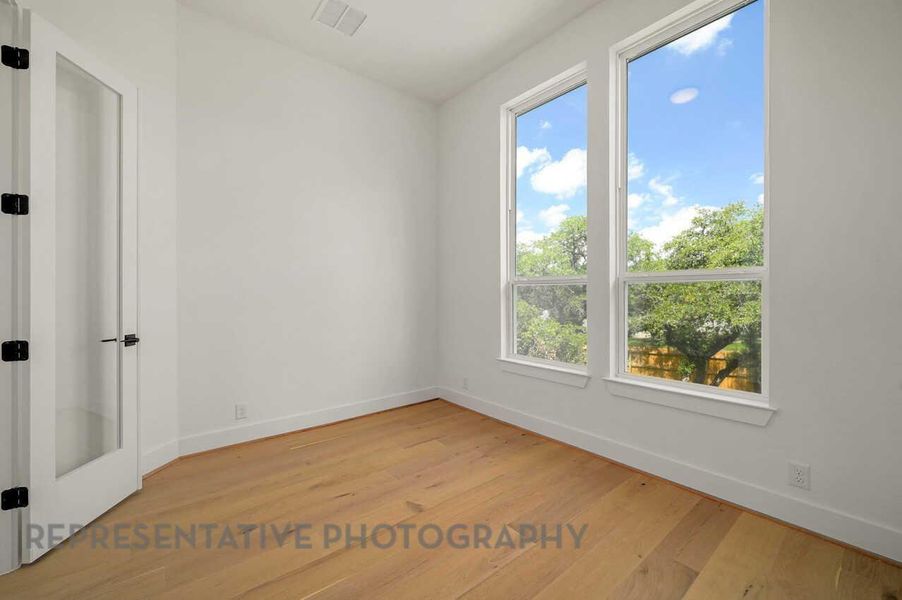 Spacious, unfurnished interior of a new home in Meridiana: 50ft. lots, Manvel (Image 19).