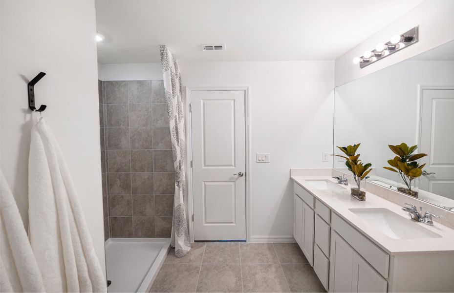 Owner's bathroom with dual sink vanity