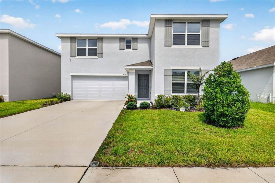 Front exterior of a new home in , Tampa, FL, highlighting curb appeal (Image 28).