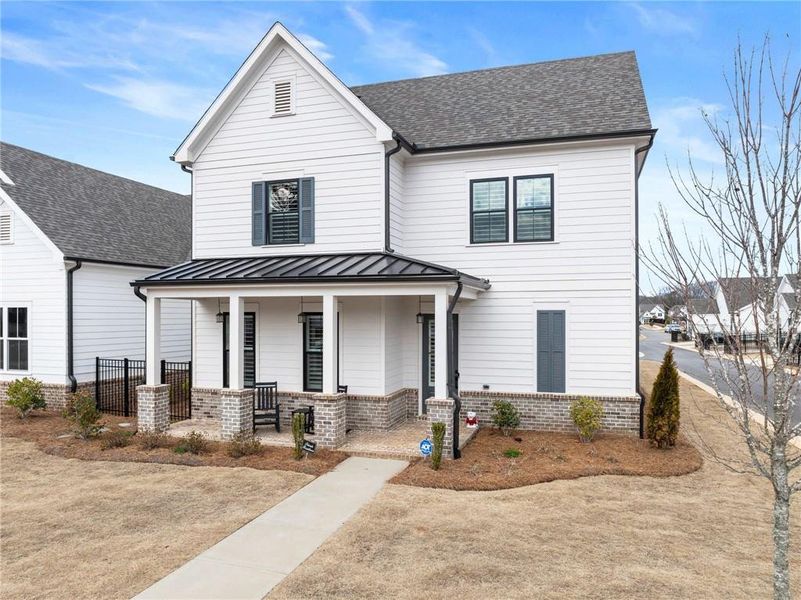 Front exterior of a new home in Promenade at Sawnee Village, Cumming, GA, highlighting curb appeal (Image 25).