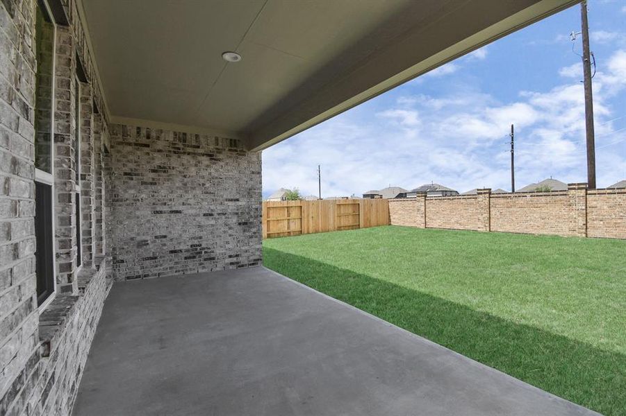 Come and see this spacious backyard with its beautiful covered patio. Sample photo, as built color and selections will vary.