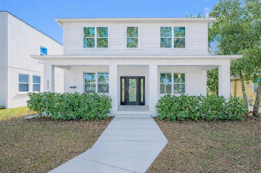 Front exterior of a new home in , St. Petersburg, FL, highlighting curb appeal (Image 1). Front exterior of a new home in , St. Petersburg, FL, highlighting curb appeal (Image 1).