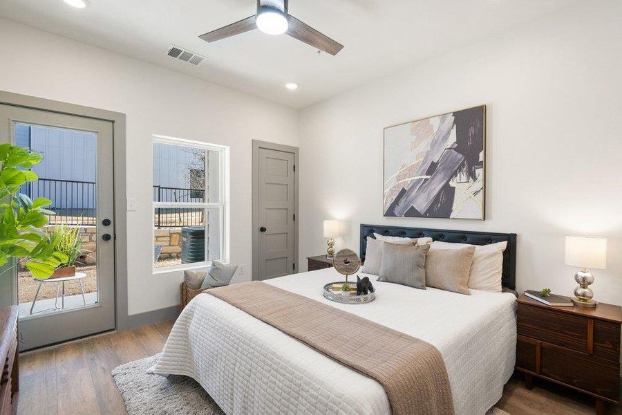 Bedroom featuring access to exterior, wood finished floors, a ceiling fan, and recessed lighting