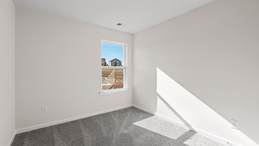 Spacious, unfurnished interior of a new home in Tanglewood Townes, Greenville (Image 22).