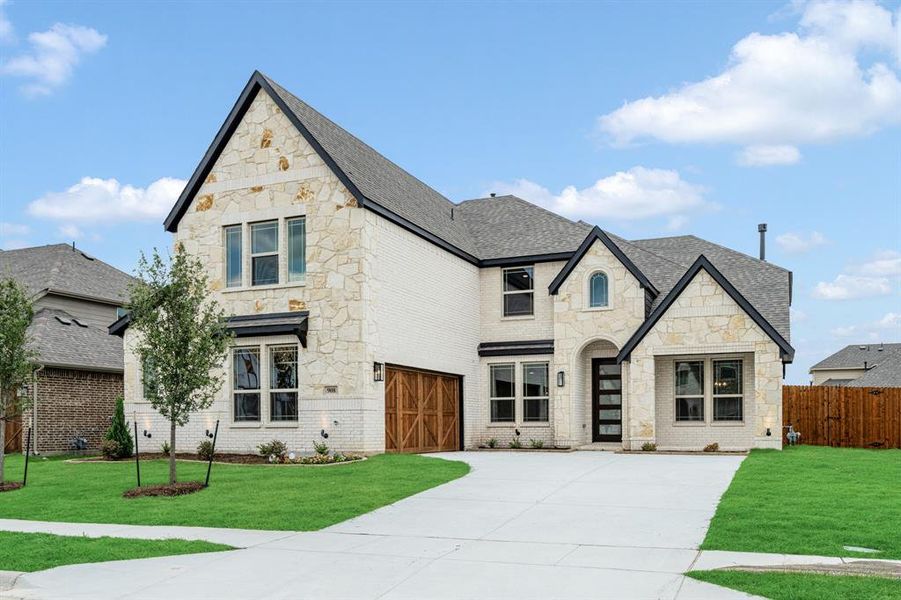 Front exterior of a new home in The Oaks, Red Oak, TX, highlighting curb appeal (Image 24).