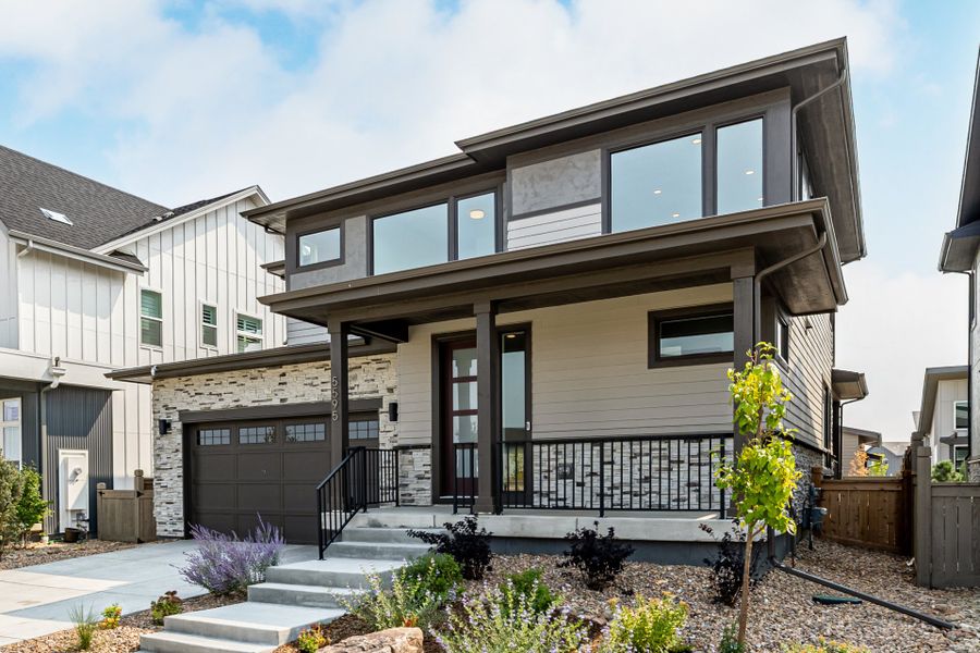Front exterior of a new home in West Grange, Longmont, CO, highlighting curb appeal (Image 23).