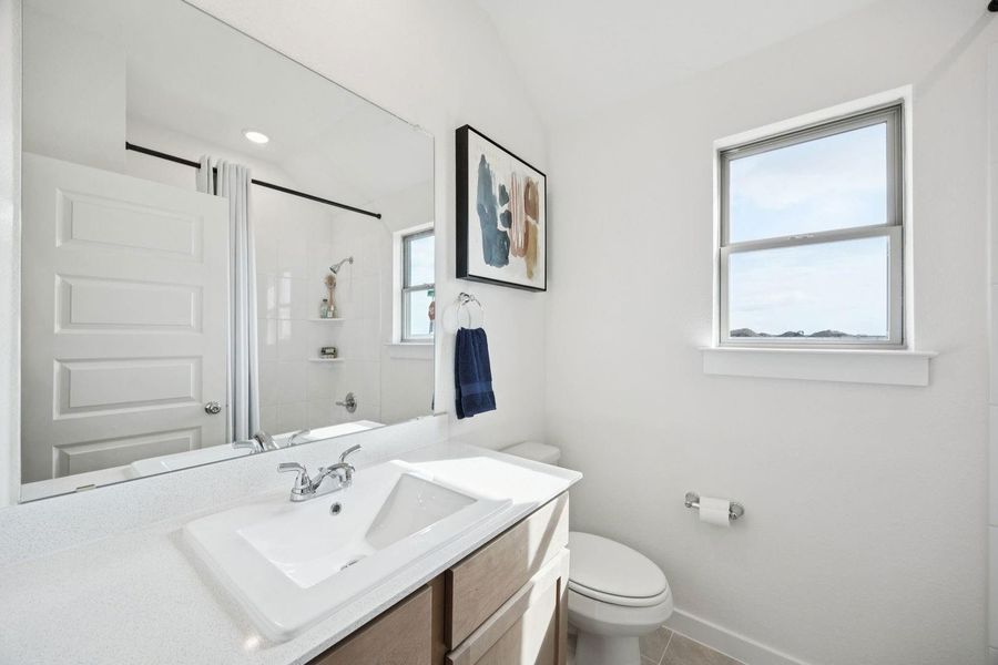 Bathroom in the Diamond home plan by Trophy Signature Homes – REPRESENTATIVE PHOTO