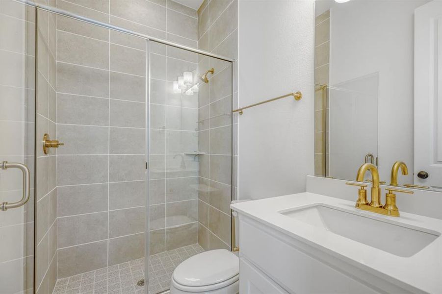 Bathroom with vanity and a shower stall