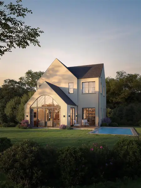 A refined stucco exterior with dramatic arched windows and a serene backyard pool await. A refined stucco exterior with dramatic arched windows and a serene backyard pool await.