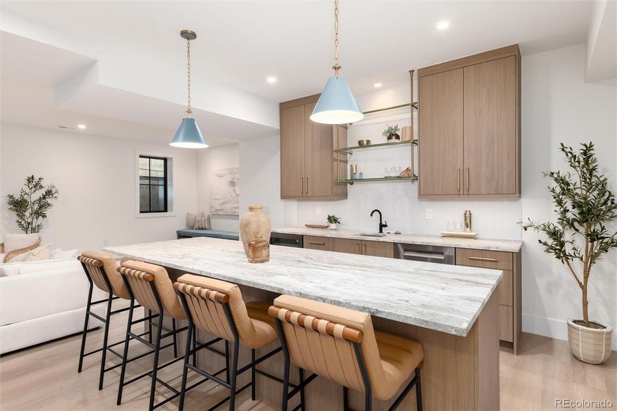 Lower level wet bar with dishwasher & beverage center. Lower level wet bar with dishwasher & beverage center.