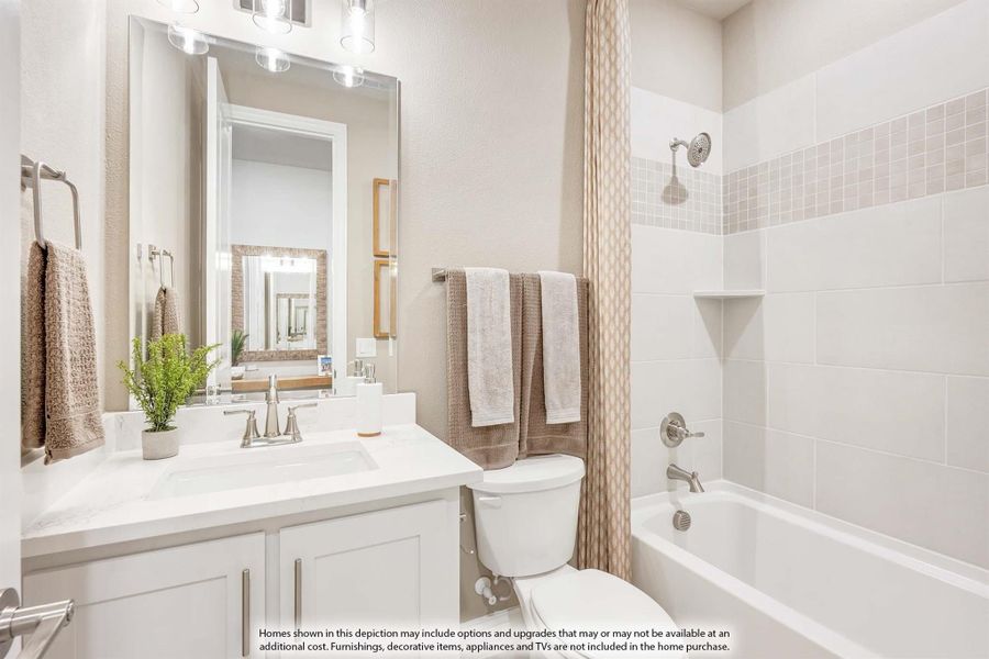 Bathroom with white vanity, tiled shower-tub combo, and large mirror with vanity lighting Bathroom with white vanity, tiled shower-tub combo, and large mirror with vanity lighting