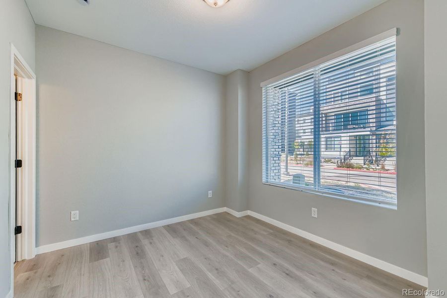 Lower level bedroom with extended lvp