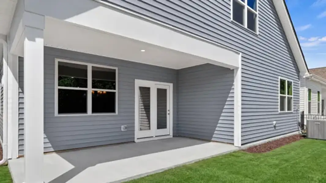 Exterior details and patio area of a home in The Villas at Galvins Ridge, Sanford (Image 3).