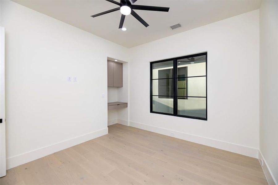 Bedroom with light wood-type flooring, recessed lighting, and a ceiling fan