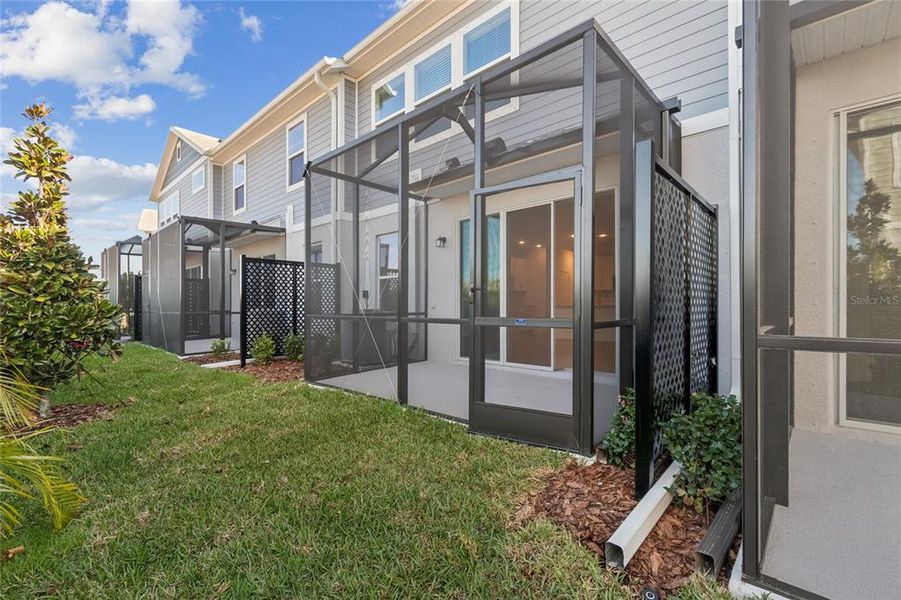 Exterior details and patio area of a home in North River Ranch – Townhomes, Parrish (Image 25).