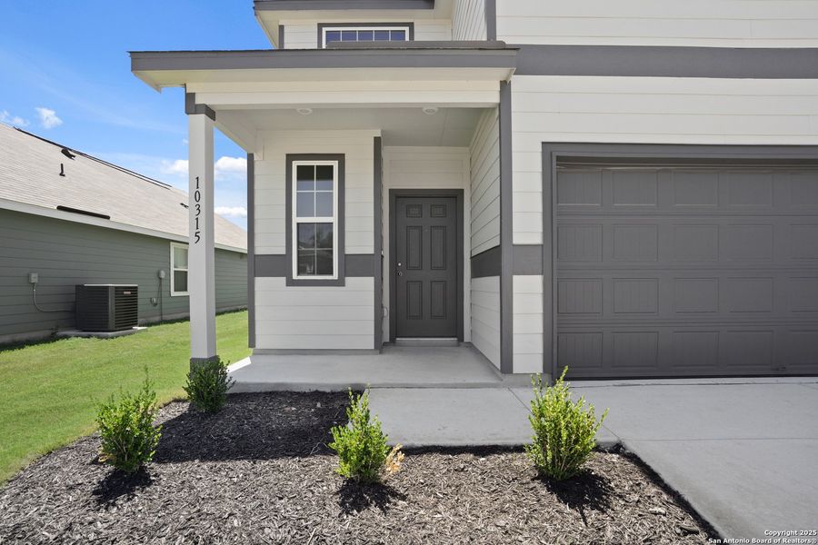 Front exterior of a new home in Applewhite Meadows, San Antonio, TX, highlighting curb appeal (Image 18). Front exterior of a new home in Applewhite Meadows, San Antonio, TX, highlighting curb appeal (Image 18).