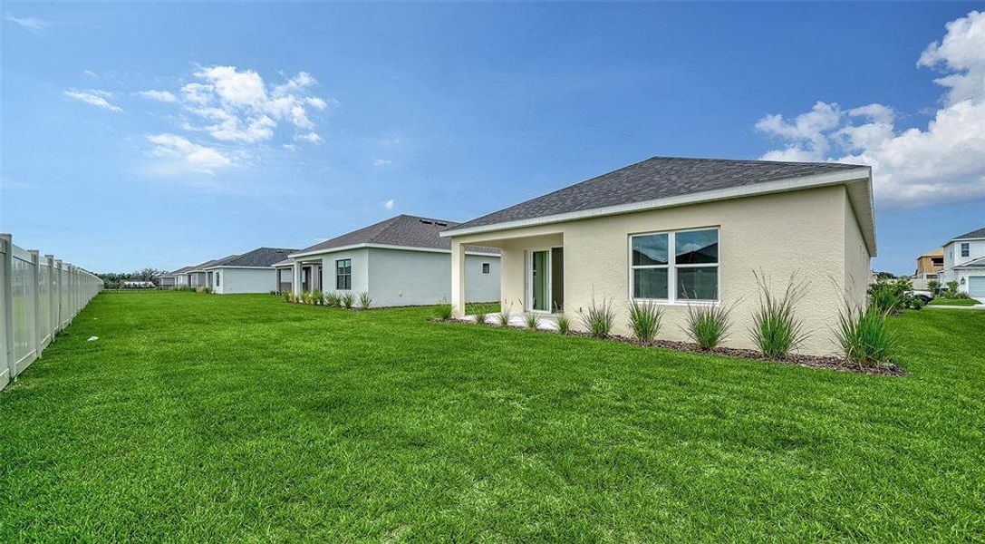 Exterior details and patio area of a home in Canoe Creek, Parrish (Image 23).
