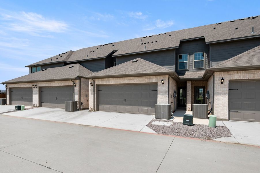 Front exterior of a new home in Sanger Circle – Townhomes, Sanger, TX, highlighting curb appeal (Image 28). Front exterior of a new home in Sanger Circle – Townhomes, Sanger, TX, highlighting curb appeal (Image 28).