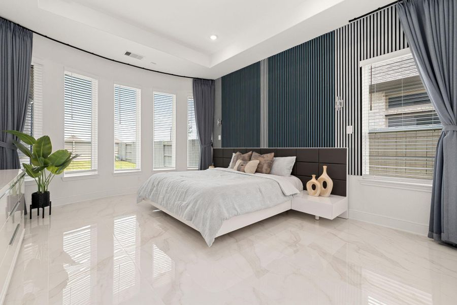 Serene primary bedroom with luxury staging, soft natural light, and a relaxing atmosphere.
