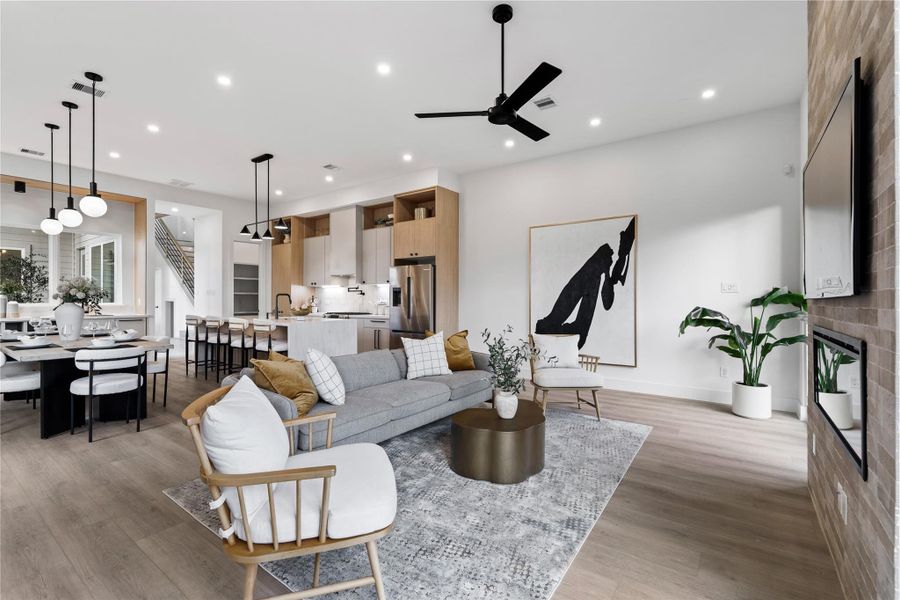 An expansive open-concept design brings kitchen, dining, and living into one cohesive experience. Clean architectural lines and warm finishes create a space that feels elevated yet completely livable.