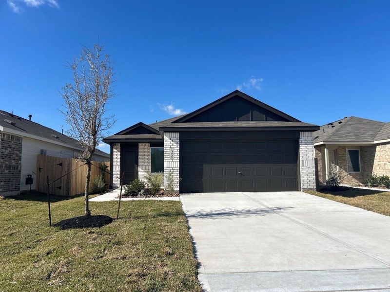 Front exterior of a new home in Sweetgrass Village, Crosby, TX, highlighting curb appeal (Image 2). Front exterior of a new home in Sweetgrass Village, Crosby, TX, highlighting curb appeal (Image 2).