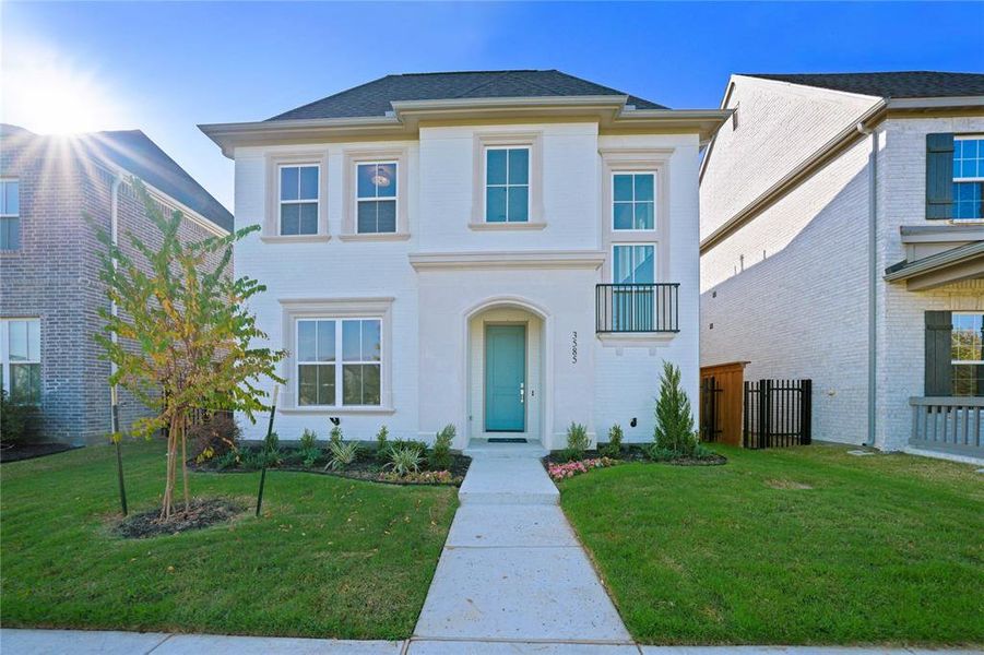 View of front of property with a balcony View of front of property with a balcony