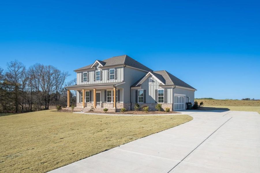 Front exterior of a new home in Magnolia Ridge, Monroe, GA, highlighting curb appeal (Image 20).