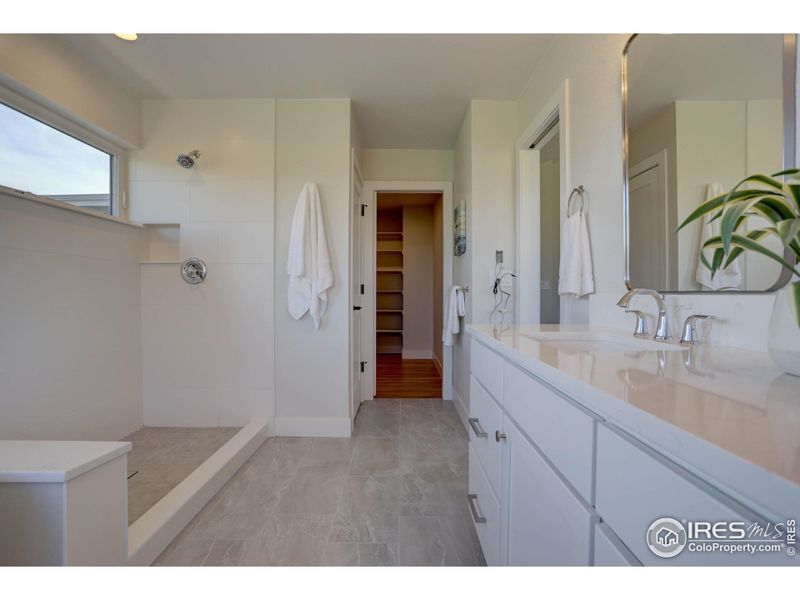 Oversized primary bathroom with shower and separate tub