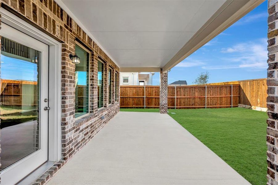 Exterior details and patio area of a home in Lily Creek at Sutton Fields, Aubrey (Image 24).
