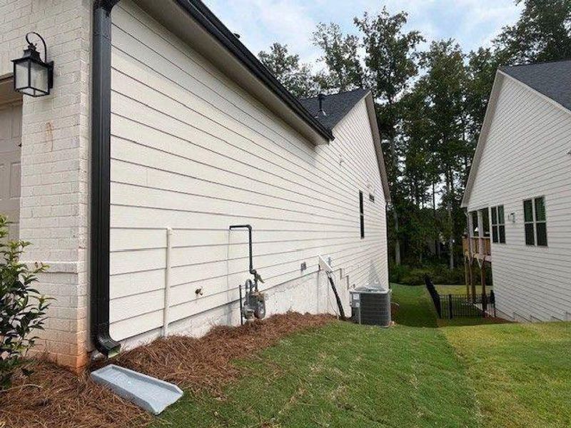 Exterior details and patio area of a home in Soleil Belmont Park, Canton (Image 22). Exterior details and patio area of a home in Soleil Belmont Park, Canton (Image 22).