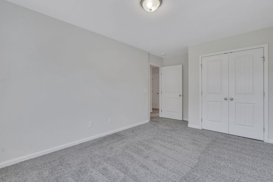 Representative unfurnished interior of a home built from the The Hatteras by Smith Family Homes in Ramsey Landing, Rincon (Image 31).