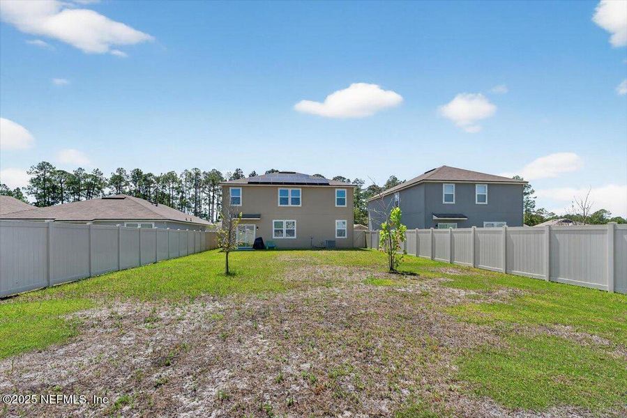 Front exterior of a new home in River Glen Express, Yulee, FL, highlighting curb appeal (Image 25).