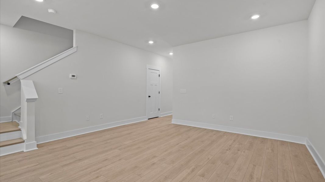 Exceptional family room with hardwood flooring in this exclusive Simpsonville-area townhome