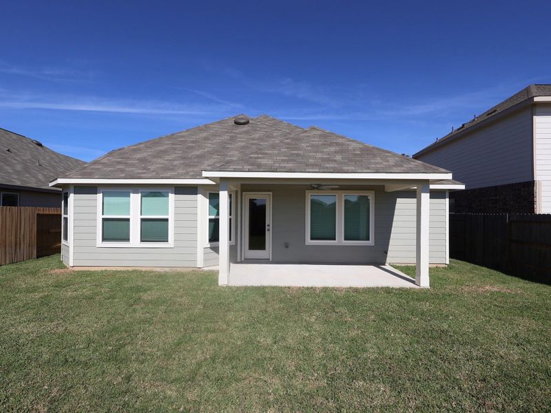 Exterior details and patio area of a home in Pinewood at Grand Texas, New Caney (Image 2).