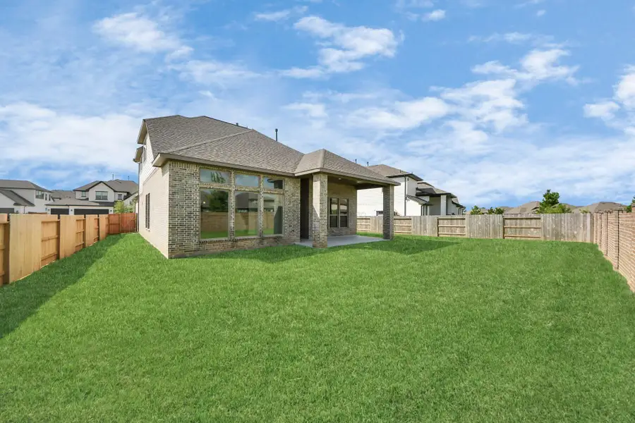 Front exterior of a new home in Marvida, Cypress, TX, highlighting curb appeal (Image 1).