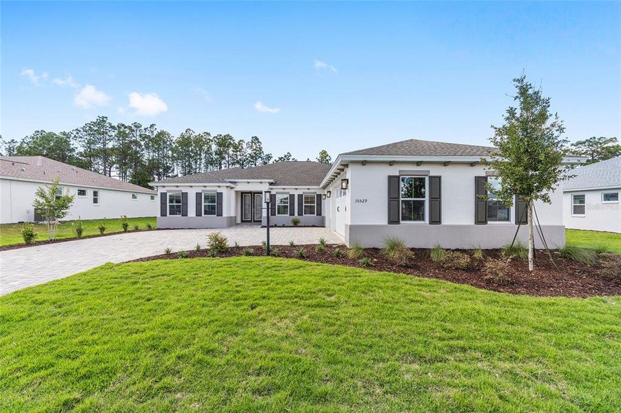 Front exterior of a new home in , Ocala, FL, highlighting curb appeal (Image 2). Front exterior of a new home in , Ocala, FL, highlighting curb appeal (Image 2).