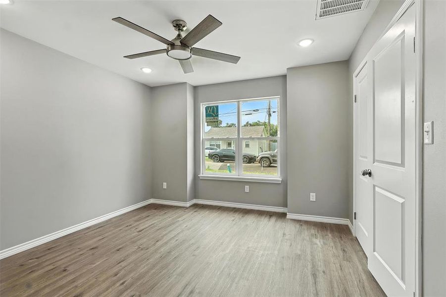 Unfurnished bedroom with wood finished floors, recessed lighting, and a ceiling fan Unfurnished bedroom with wood finished floors, recessed lighting, and a ceiling fan