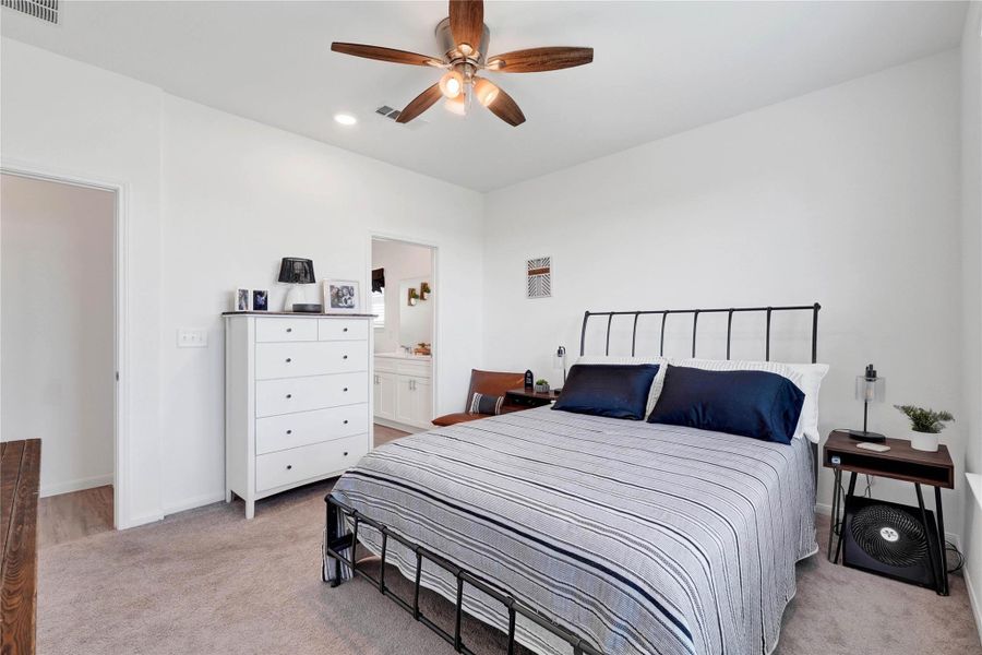 Retreat to a spacious master suite that exudes comfort and tranquility, complete with plush finishes, generous closet space, and serene views of the backyard.