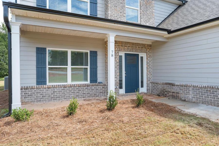 Front exterior of a new home in , McDonough, GA, highlighting curb appeal (Image 18).