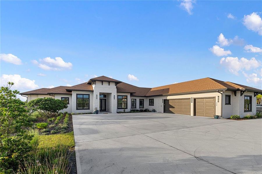 Front exterior of a new home in , Oviedo, FL, highlighting curb appeal (Image 24). Front exterior of a new home in , Oviedo, FL, highlighting curb appeal (Image 24).